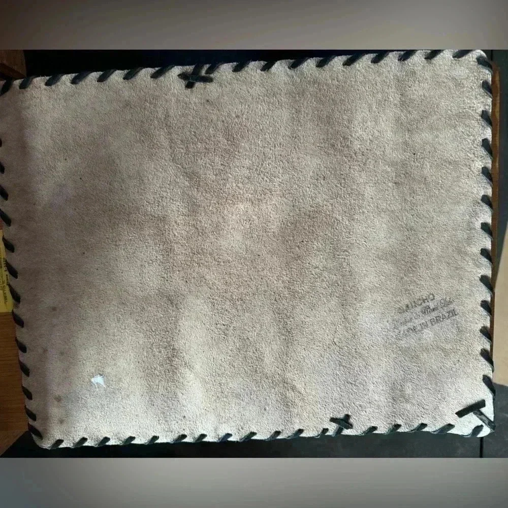 Cow hide tiger strip placemat.  A few areas where hair is gone. See photos.